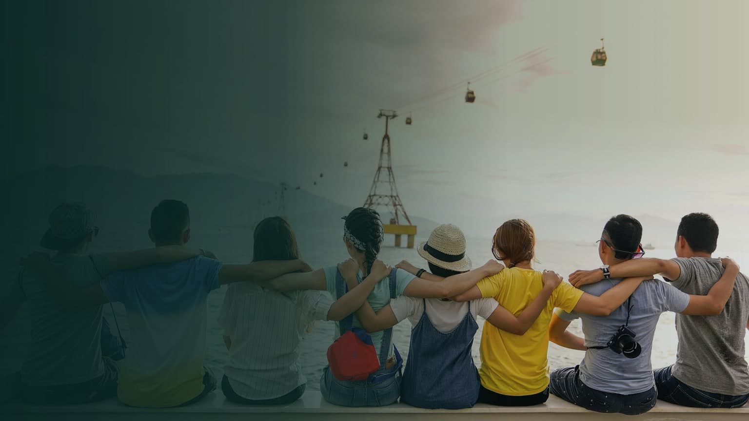 A community of friends standing together beside the water